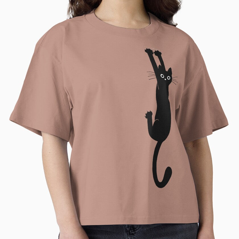 Black Cat Holding On Cute Boxy T-Shirt Funny Animal Lover Tee Hazy Pink